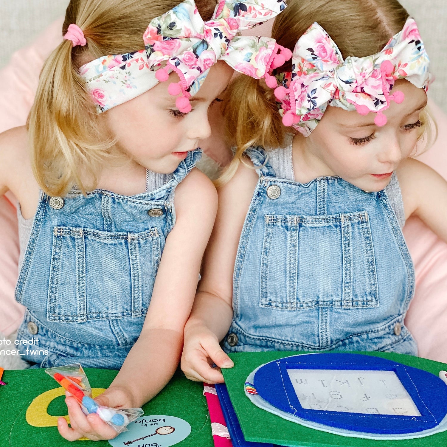 two curious children playing with educational toys