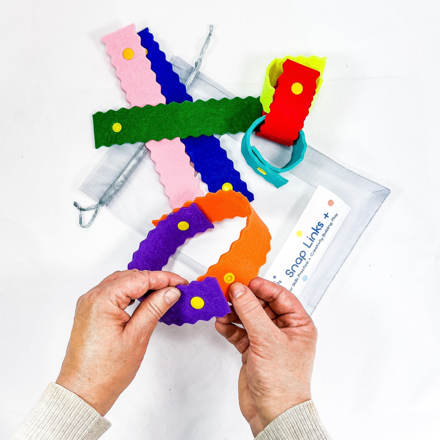 fine motor skills toys for children made from coloful felt strips